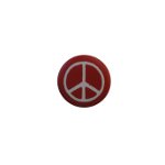 Badge petit ☮blanc fond rouge 