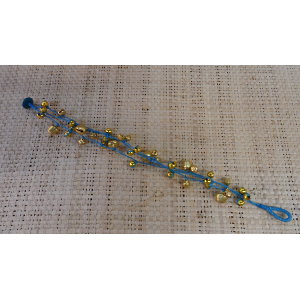 Bracelet de cheville bleu à grelots dorés