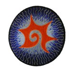 Ecusson tribal spirale étoilée orange