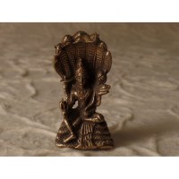Miniature Bouddha sous abri serpent